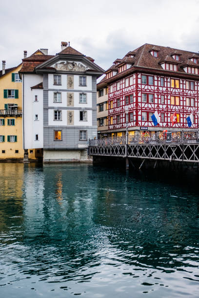 istock Buildings By River Against Sky 1038459210