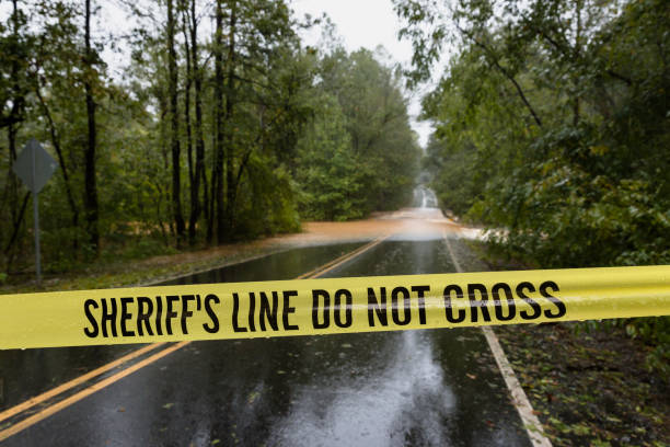 istock Police tape blocks a flooded road 1038483160