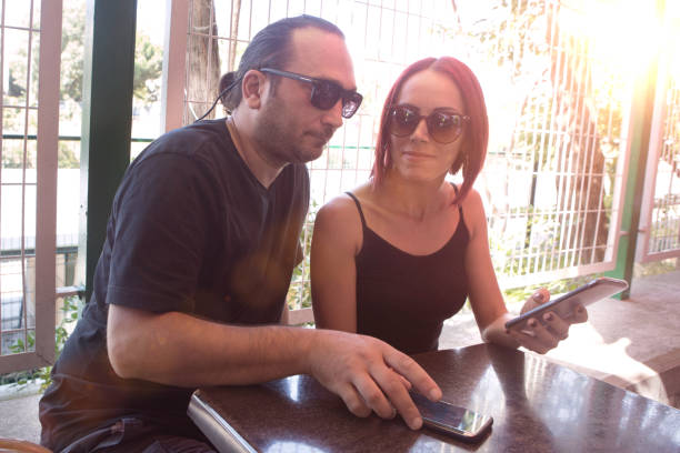 istock Happy couple looking at mobile phone. 1038496342