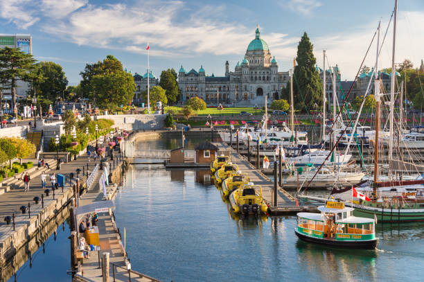 Victoria Harbour and British Columbia Parliament Buildings at sunset stock photo