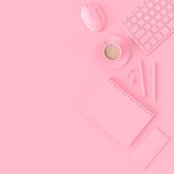 istock Minimal concept. Coffee milk  in pink cup beside keyboard 1038549978