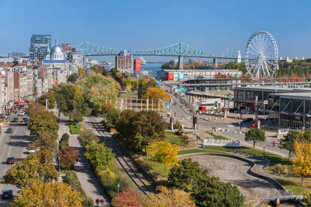 Aerial view of the Old Port of Montreal, with Obsevation Wheel, Jacques Cartier Bridge and Bonsecours Market Montreal, CA - 21 October 2017: Aerial view of the Old Port of Montreal, with Obsevation Wheel, Jacques Cartier Bridge and Bonsecours Market old port photos stock pictures, royalty-free photos & images
