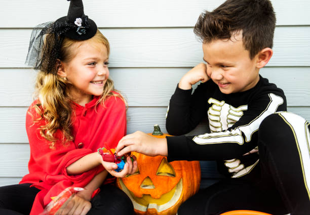 istock Little children trick or treating 1038574144