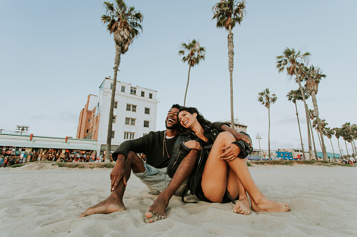 Couple relaxing at Venice Beach