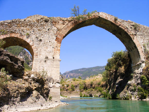 istock Panorama view to old ruined bridge over Dalaman river, Turkey 1038589994