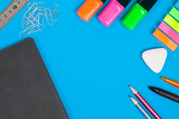 istock Stationery accessories or school goods lie on blue background.  Top view. 1038589996