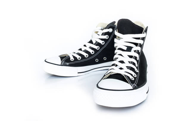 istock black sneakers classic vintage shoe on white background 1038596054