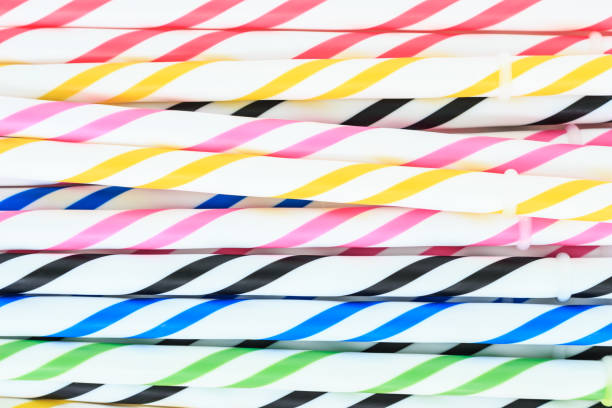 istock Striped drink straws in different colors background. 1038599256