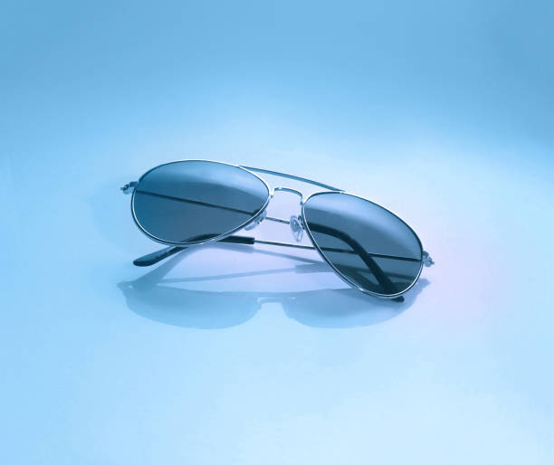 istock Sunglasses on trendy blue background. 1038599662