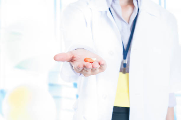 istock Nurse giving medical pills 1038602980