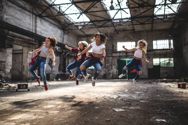 istock Women break-dancers jumping 1038605564