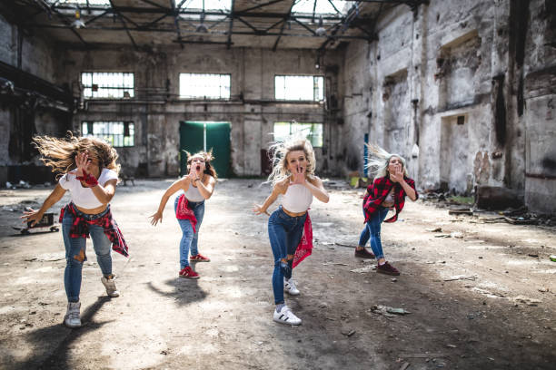 istock Motivated group of female break-dancers 1038605596