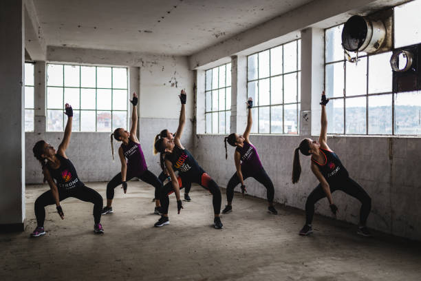 istock Synchronized group of women work out in old factory 1038605922