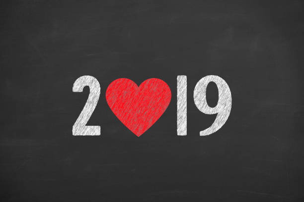 istock New Year 2019 with Heart Shape on Chalkboard Background 1038612620