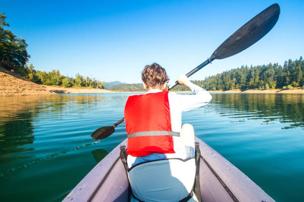 istock Strong young girl kayaking 1038613132