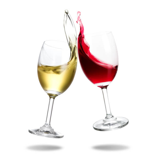 Cheering wine Cheers wine with splash out of glass isolated on white background. wineglass stock pictures, royalty-free photos & images