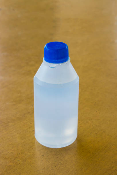 hydrogen peroxide medicine white plastic bottle closeup hydrogen peroxide medicine white plastic bottle closeup on wooden table hydrogen peroxide stock pictures, royalty-free photos & images