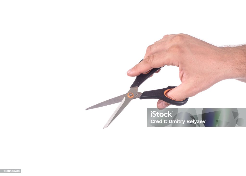 business, people, and office concept - close up of businessman hand holding scissors business, people, and office concept - close up of businessman hand holding scissors. Adult Stock Photo