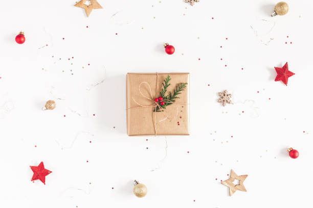 istock Christmas composition. Christmas gifts, conifer branches, red and golden decorations on white background. Flat lay, top view, copy space 1038633892