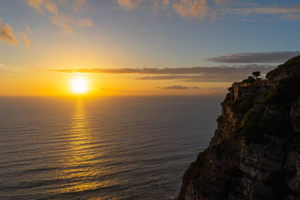 istock Golden sunset on Amalfi coast cliff 1038634040