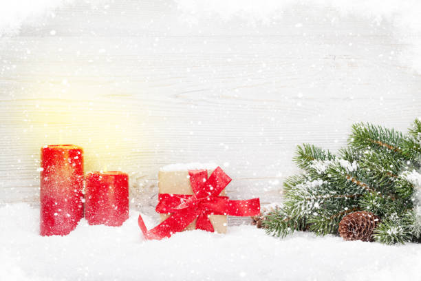 istock Christmas gift box, candles and fir tree branch 1038636686
