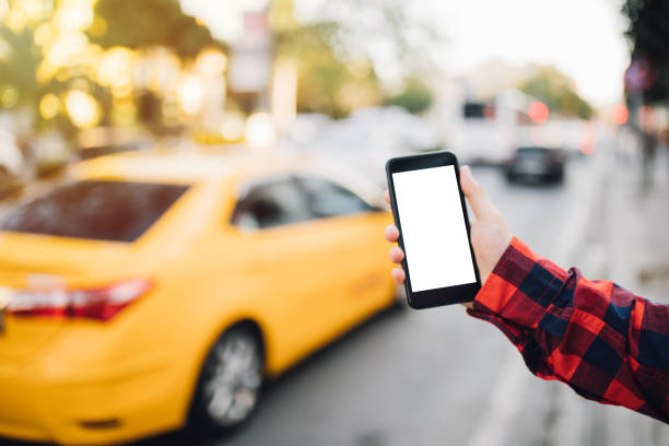 istock Smart phone with yellow cab in background 1038637242