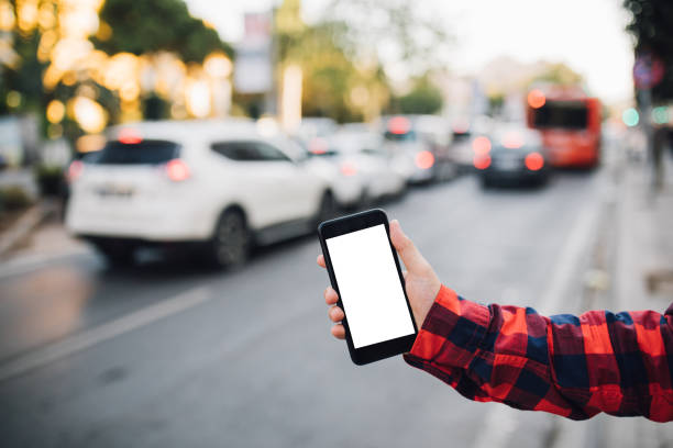 istock Smart phone with yellow cab in background 1038637416