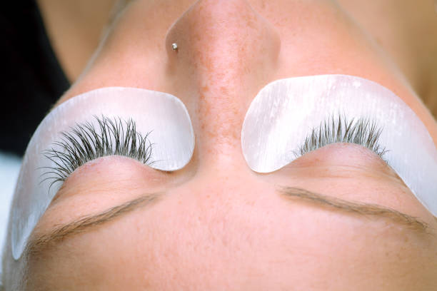 istock Eyelash extension procedure, woman eye with Long eyelashes 1038639768