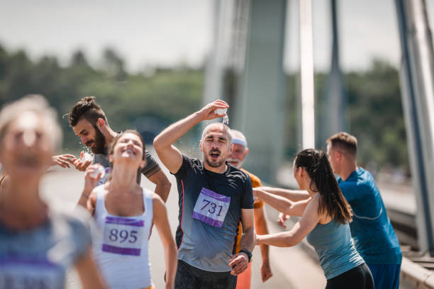 istock Refreshment on marathon race during hot summer day! 1038639868