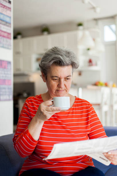 istock senior woman drinking coffee 1038639932