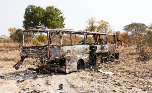 istock Burned bus at the side of the road 1038640396