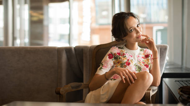 istock Attractive, stylish woman drinking coffee at cafe 1038640674