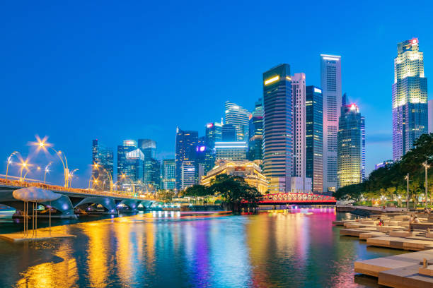 istock Singapore financial district skyline at Marina bay on twilight time. 1038650042