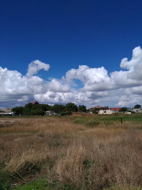 istock Beautiful clouds over the village 1038654148