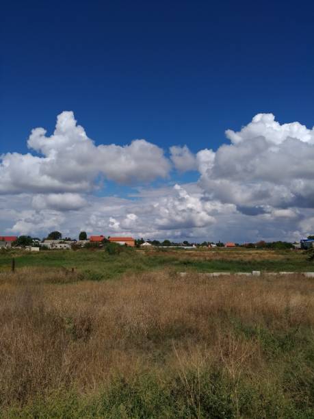 istock Beautiful clouds over the village 1038654156