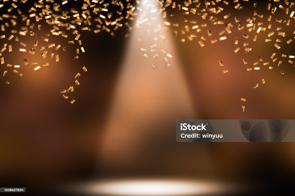 festive shower of golden confetti shower of golden confetti on festive stage Award Stock Photo