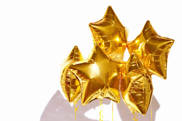 istock festive golden star balls on white background 1038658048