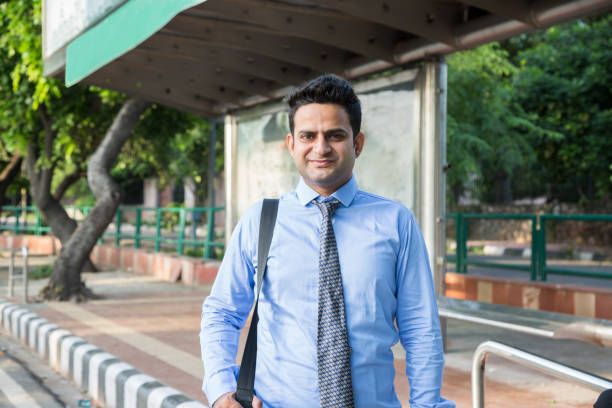 istock Young businessman waiting at Bus Stop - Stock image 1038666630