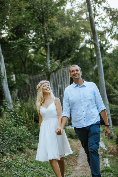 istock Beautiful young couple walking in nature 1038670568