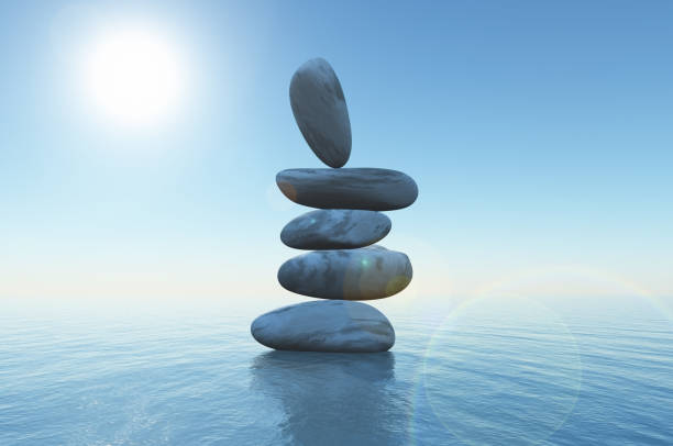 istock 3D balancing stones in the ocean 1038670894