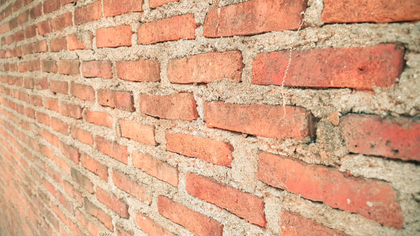istock Side view of old orange vintage brick wall 1038677914