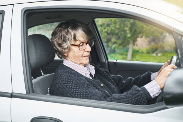 istock Senior woman confidently driving her car 1038678410