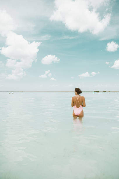 istock Woman walking in a lagoon 1038678952