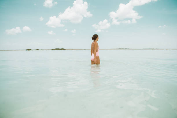 istock Woman walking in a lagoon 1038678958