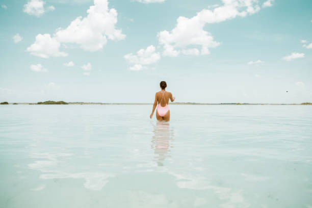 istock Woman walking in a lagoon 1038679044