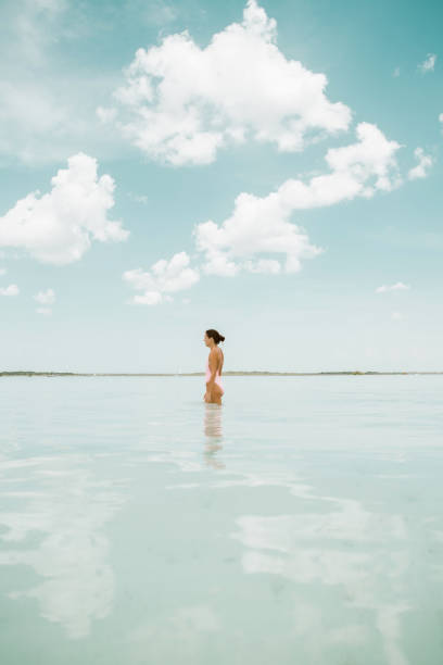 Woman walking in a lagoon
