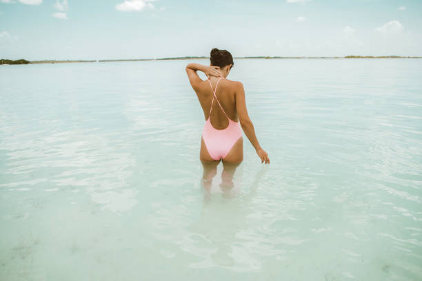 istock Woman walking in a lagoon 1038679084