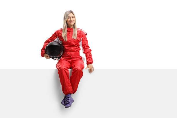 istock Female racer in a suit sitting on a panel 1038679188