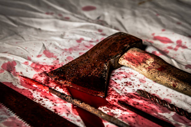 Low angle close-up of bloody axe and torture tools Low angle close-up of bloody axe and torture tools serial killings photos stock pictures, royalty-free photos & images