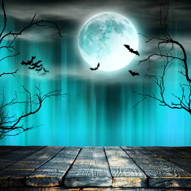 istock Spooky Halloween background with old trees silhouettes. 1038690720